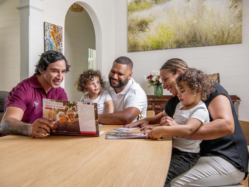 Family with JT sitting at a table